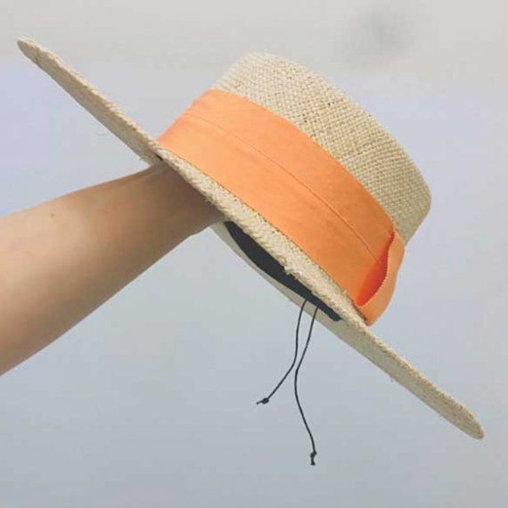 Соломенная шляпа с оранжевой лентой